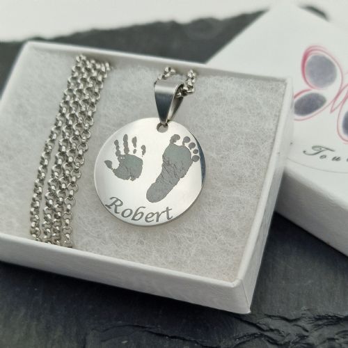Engraved circle hand and footprint necklace