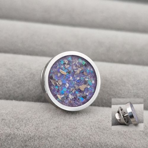 Circle lapel or tie pin with ashes
