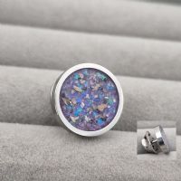 Circle lapel or tie pin with ashes