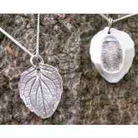 Silver leaf pendant with hidden fingerprint