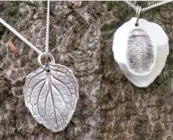 Silver leaf pendant with hidden fingerprint